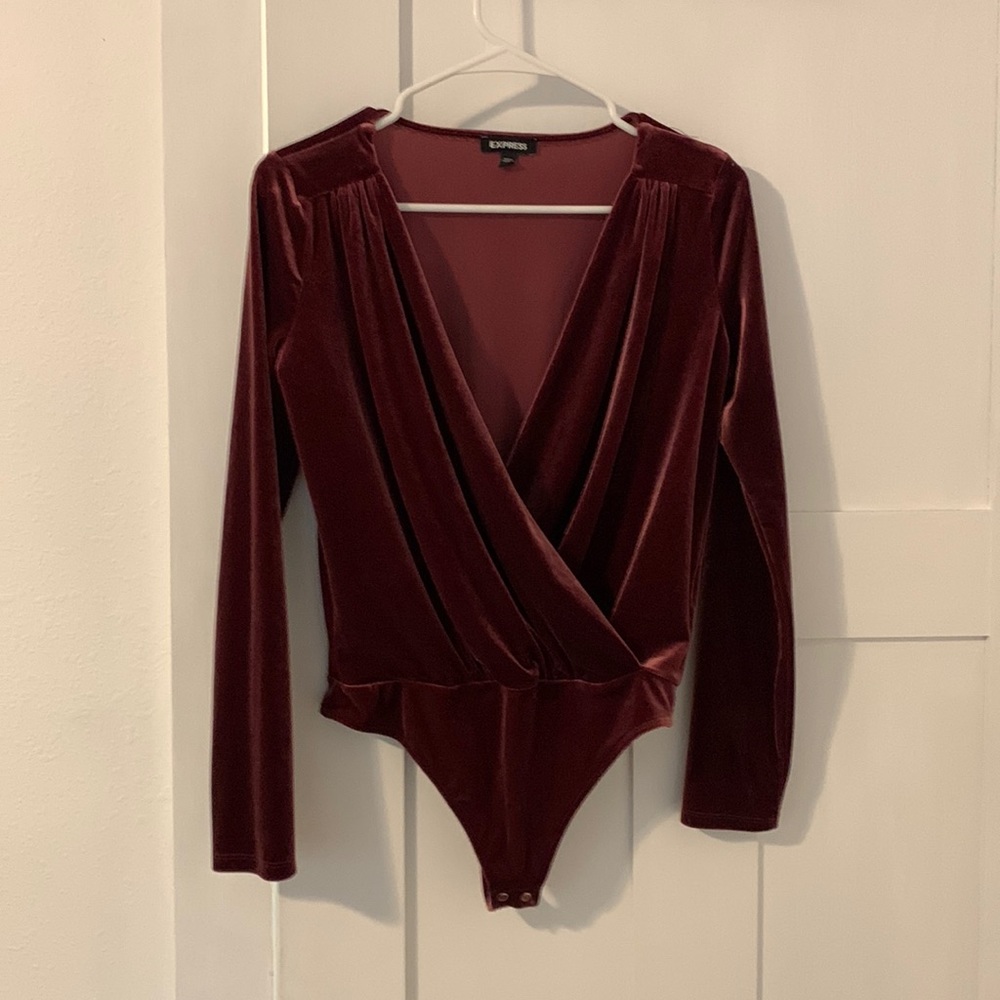 Express long sleeved bodysuit. Size small.